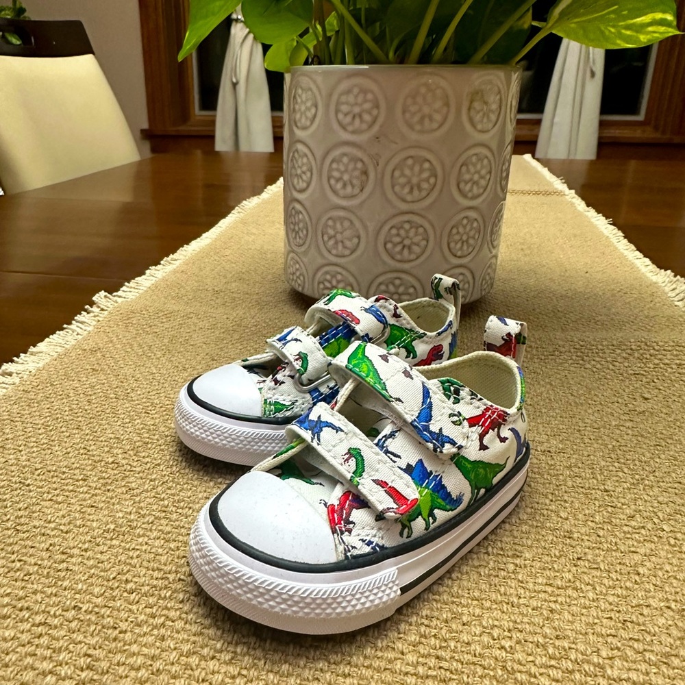 Brand new - never worn baby/toddler size 4 dinosaur style converse. Super cute!